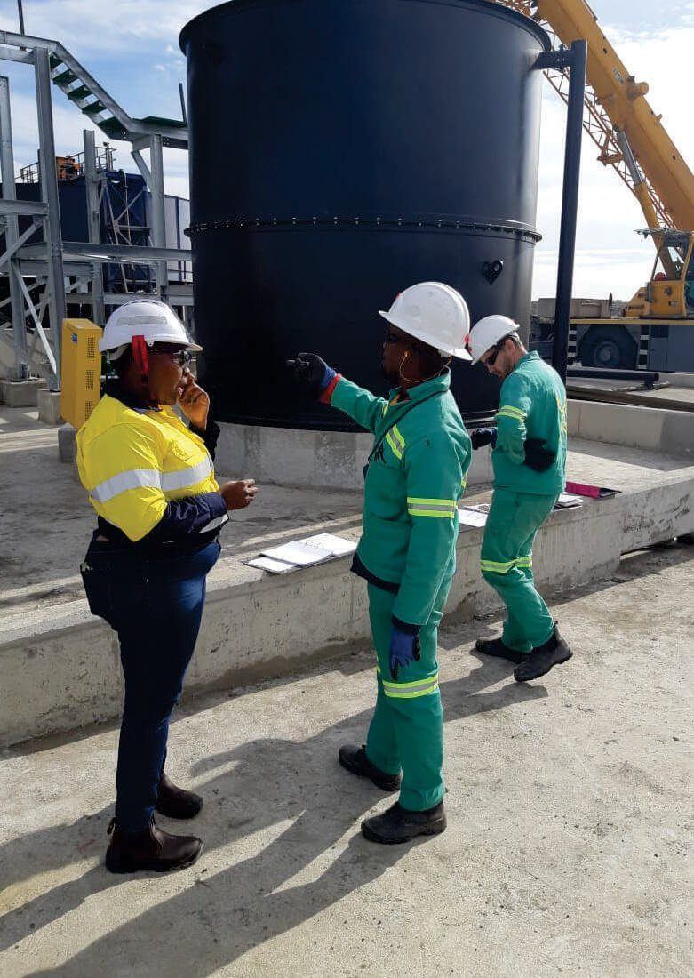 Ditsogo engineers inspecting a process tank on site