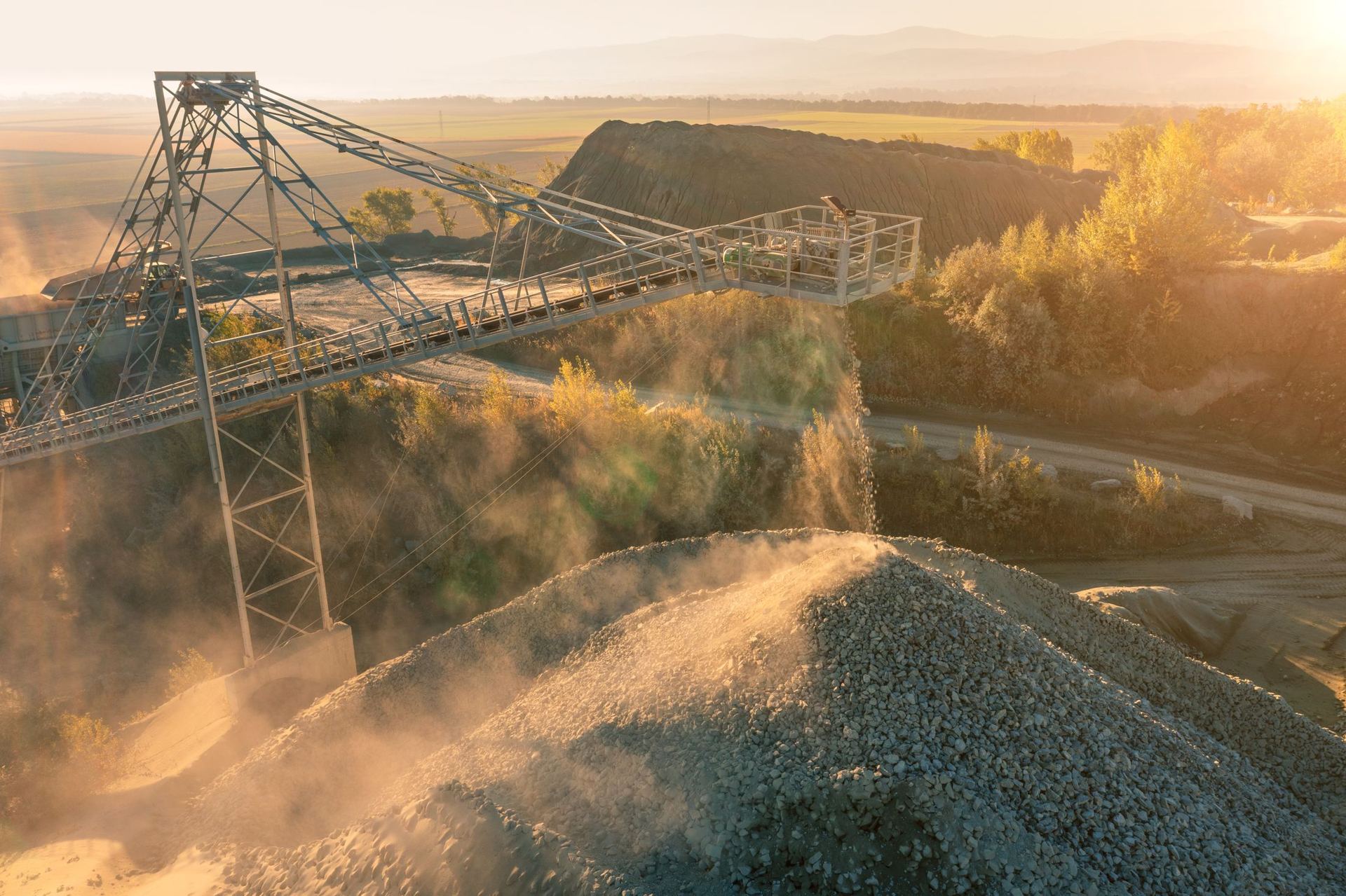 Overland conveyor and materials handling plant at sunrise