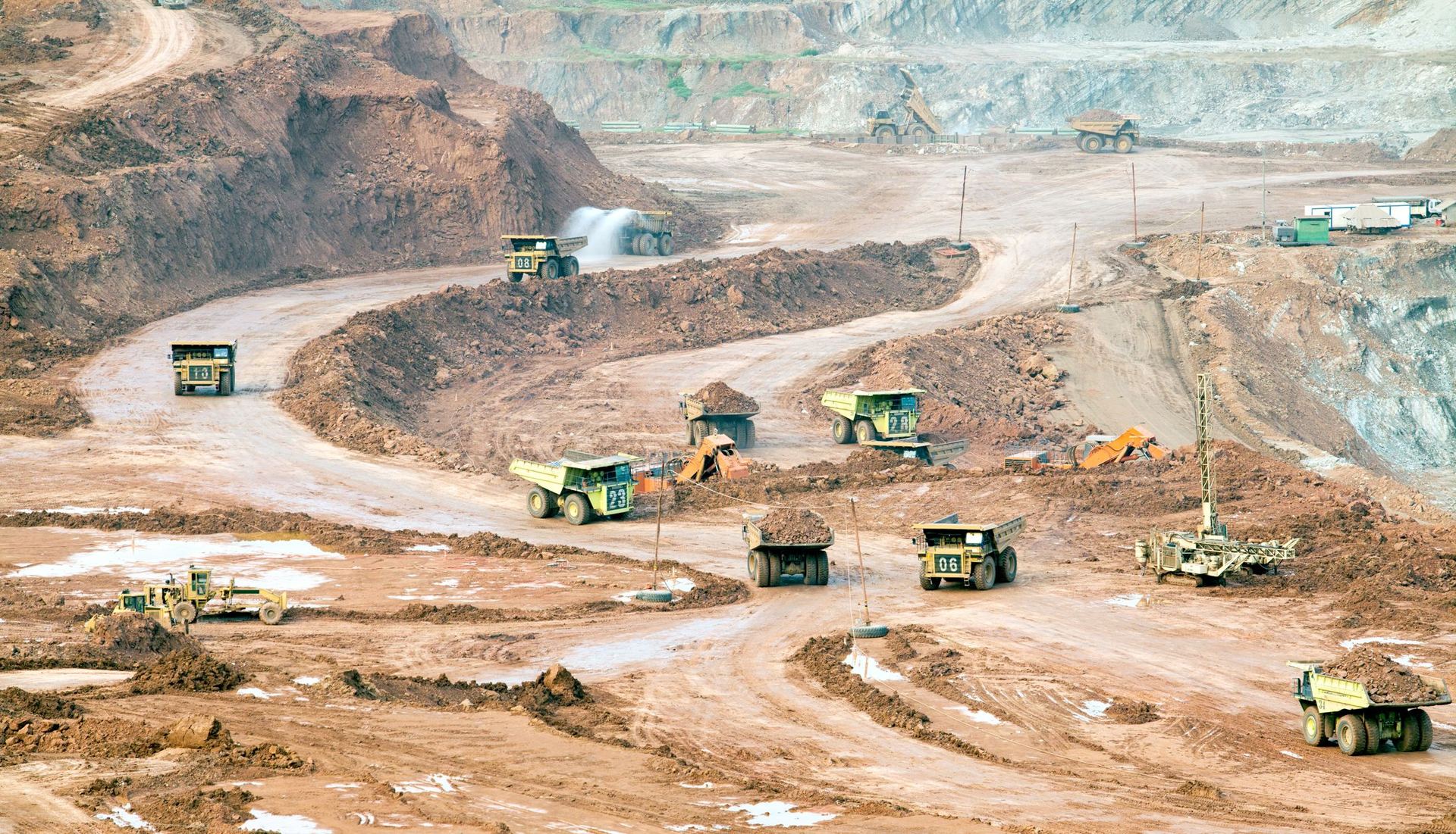 Haul trucks and mining fleet working an open pit