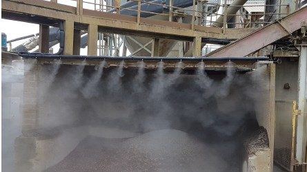 Dust suppression system operating at a processing plant