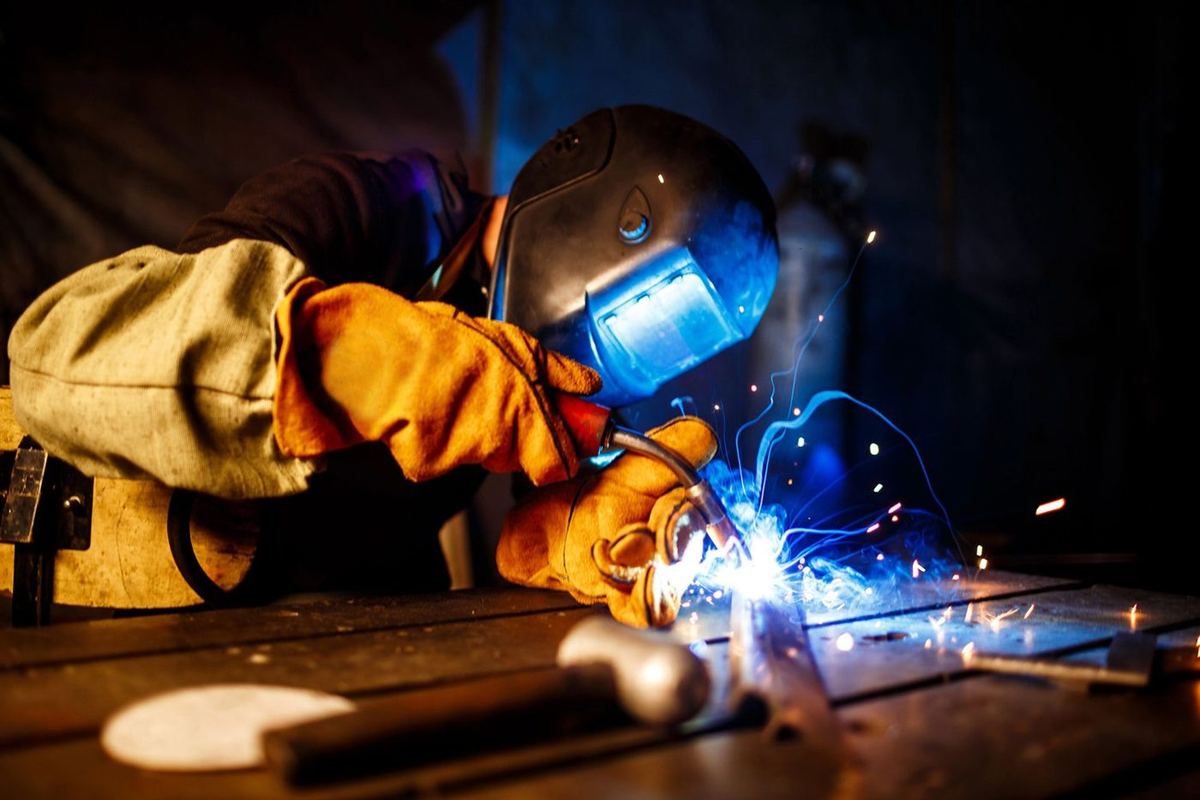 Welder fabricating structural steel