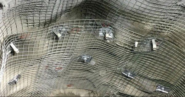 Wire mesh and roof bolt support installation underground